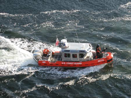 armed us coast guard escorting cruise ship in ketchikan